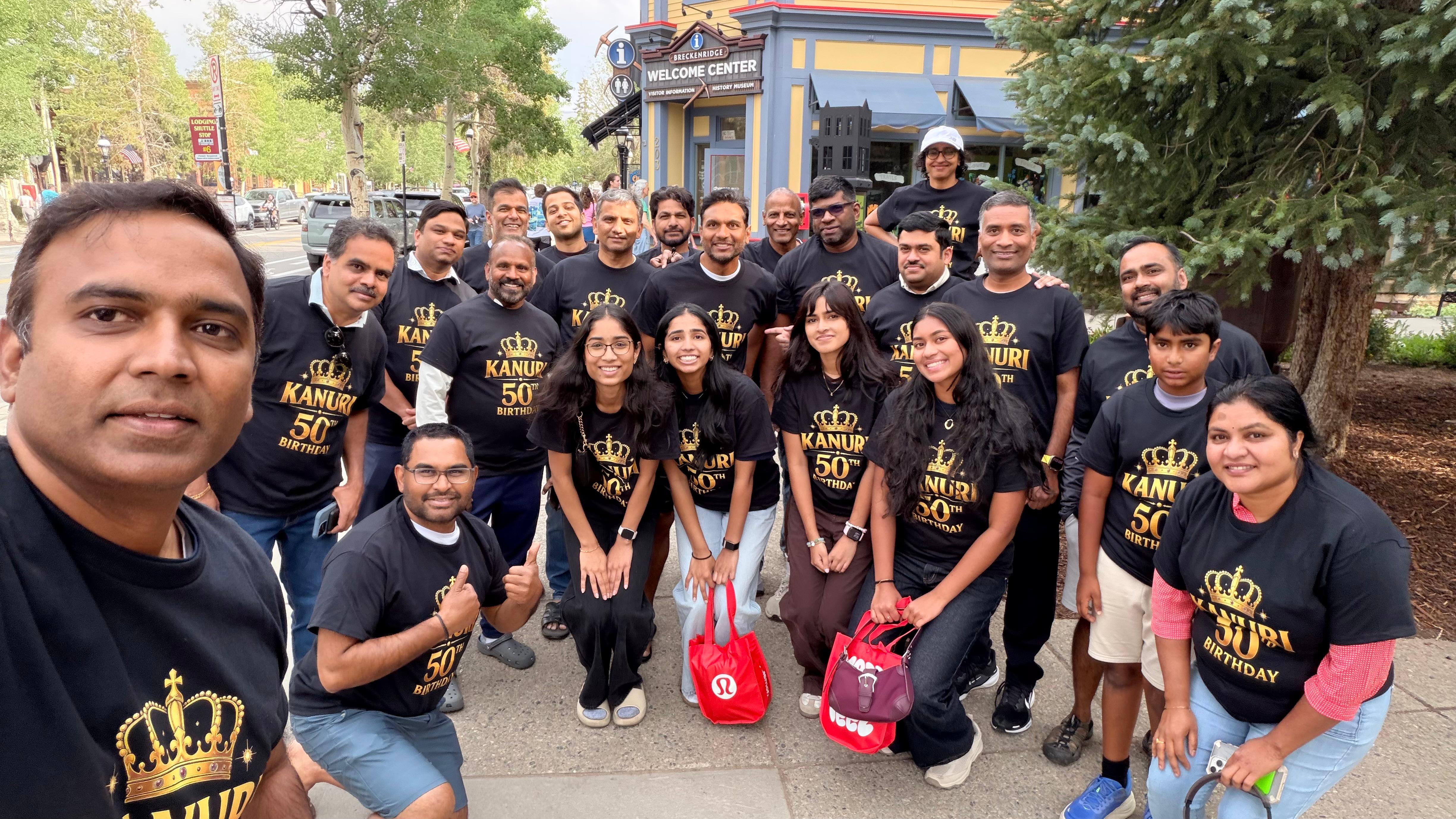 The whole group in Kanuri 50th Birthday shirts at the Breckenridge Welcome Center