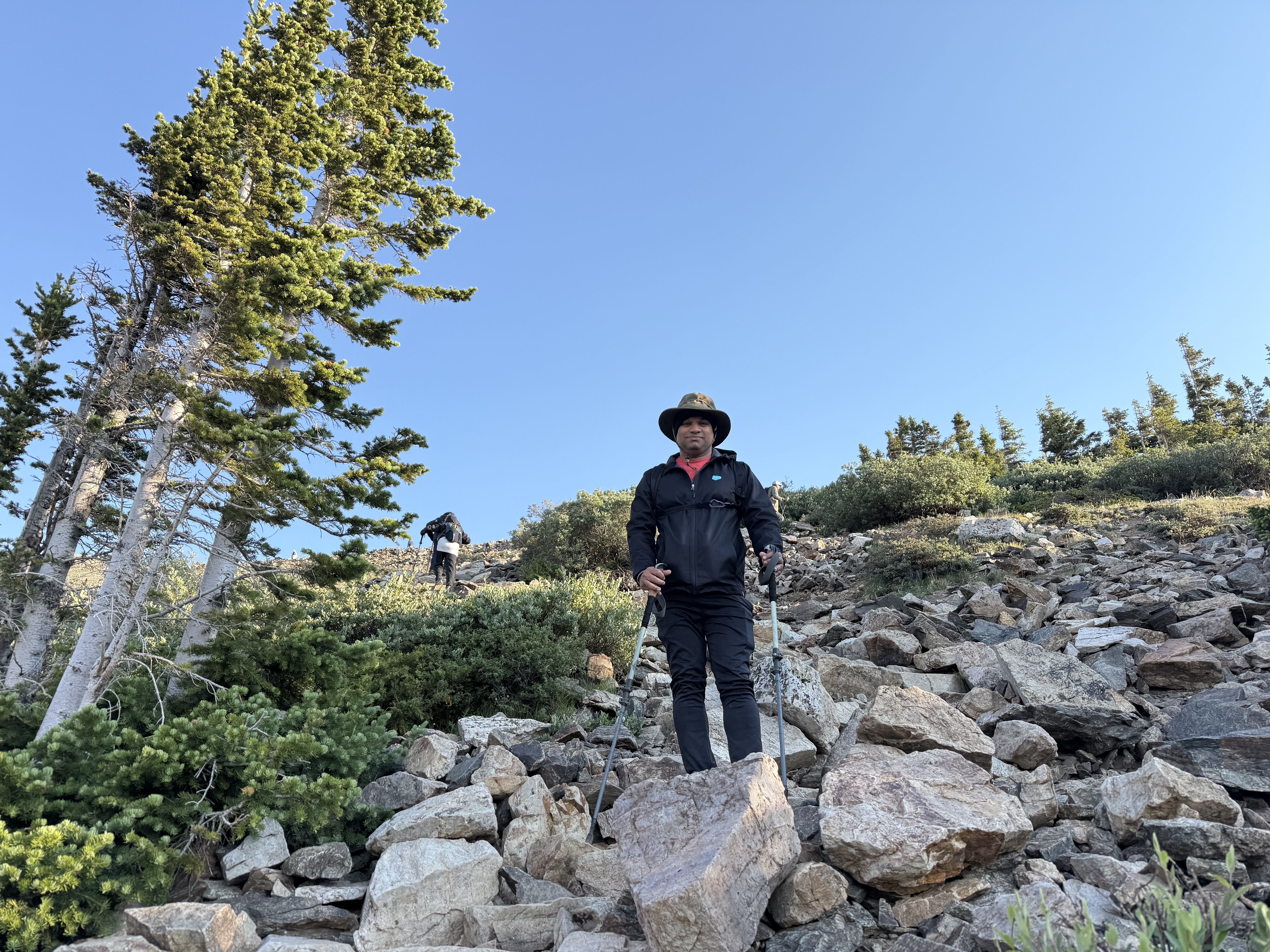 Hiker on the talus below treeline